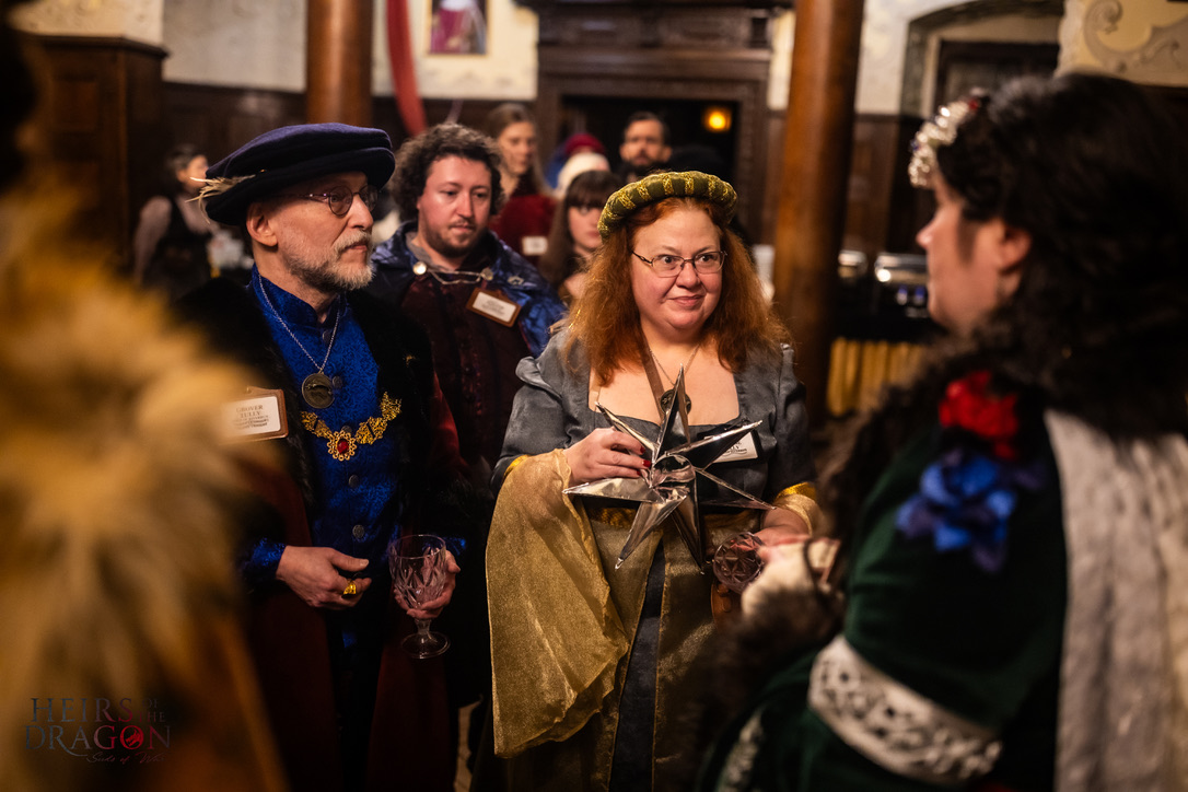 Lord Tully, Lady Tully, and Walter Tully accept bread and salt from Lady Strong